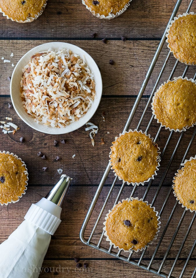 These Pumpkin Chip Cupcakes with Spiced Cream Cheese Frosting are insanely delicious and so easy! They start with a box cake mix and I can't wait to make them again!