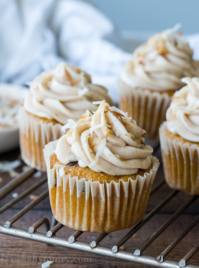 These Pumpkin Chip Cupcakes with Spiced Cream Cheese Frosting are insanely delicious and so easy! They start with a box cake mix and I can't wait to make them again!