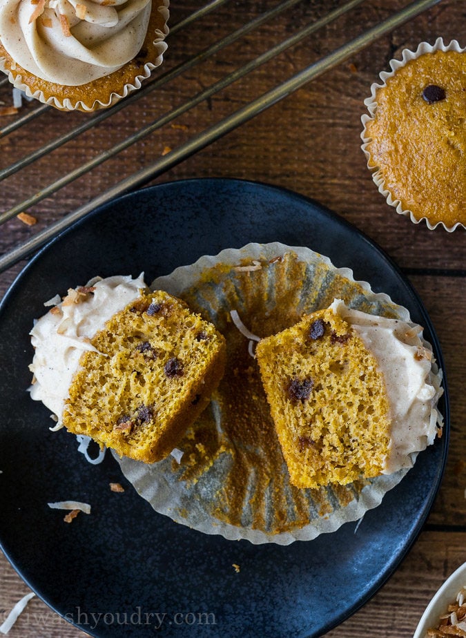 These Pumpkin Chip Cupcakes with Spiced Cream Cheese Frosting are insanely delicious and so easy! They start with a box cake mix and I can't wait to make them again!