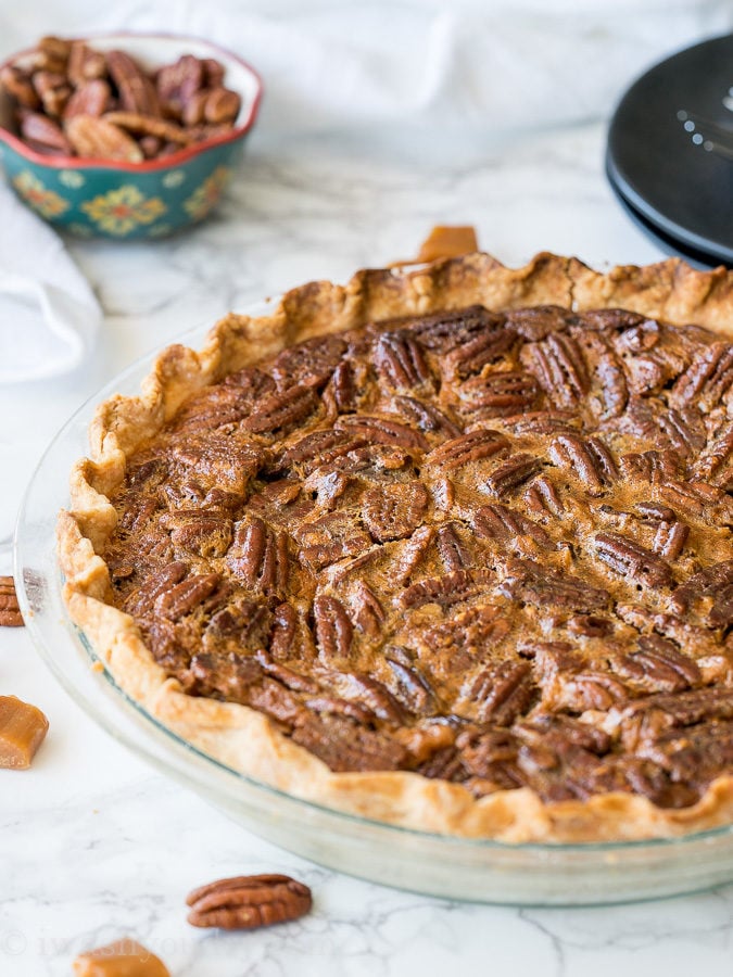 This Classic Pecan Pie Recipe has a twist of caramel which makes it the perfect addition to your holiday table!