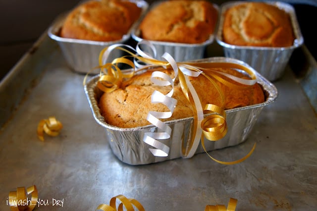 A small loaf of Eggnog Bread wrapped with a ribbon