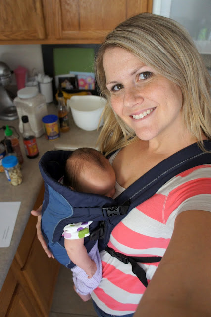 Shawn from I Wash You Dry with a baby in a baby carrier