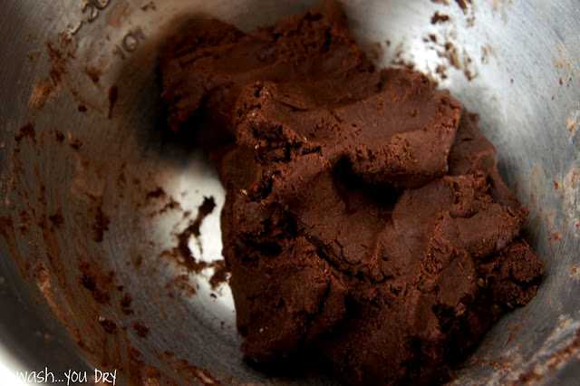 A close up of chocolate dough in a bowl