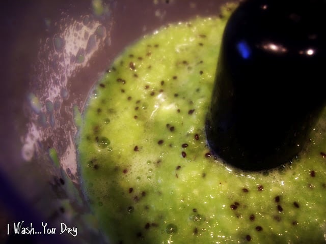 A close up of kiwi in a blender. 