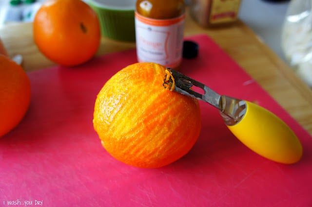 An orange being zested