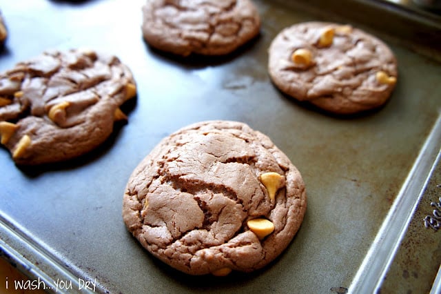 Chocolate cookies with peanut butter chips on a a pan