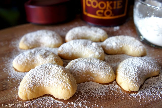 Dust the Almond Crescent cookies with some powdered sugar and enjoy!