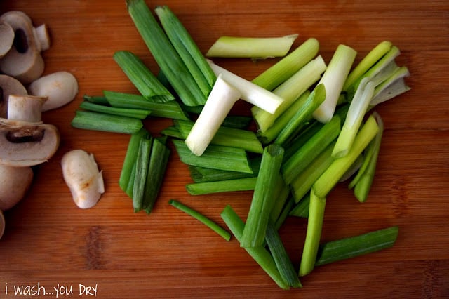 A pile of green onions chopped into large chunks