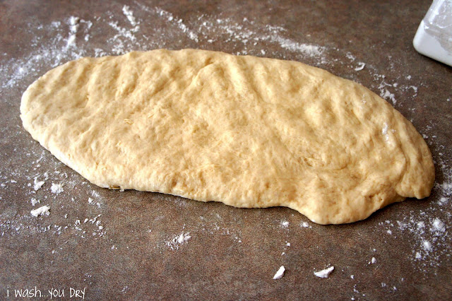 Cake Batter Cinnamon Roll dough laid out on a counter