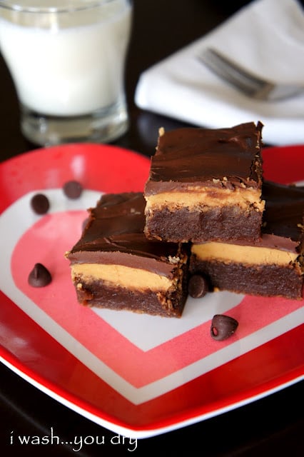 A chocolate brownies on a plate, made with Peanut butter and Fudge