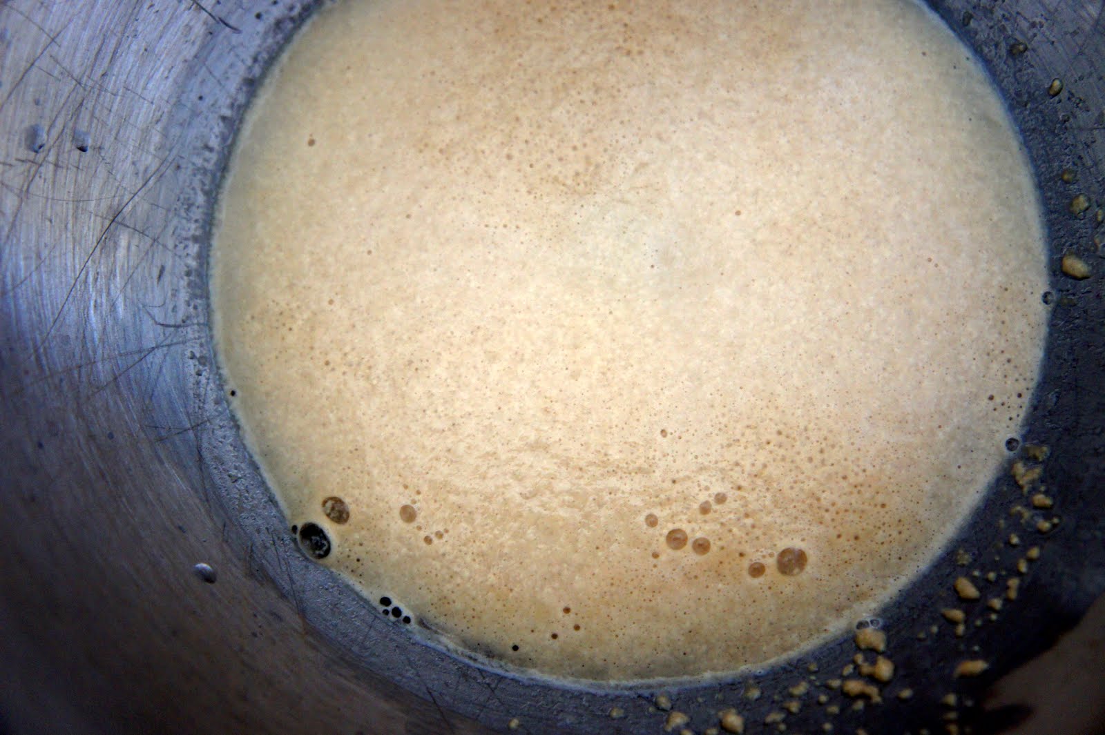 A close up of a mixing bowl with activated yeast