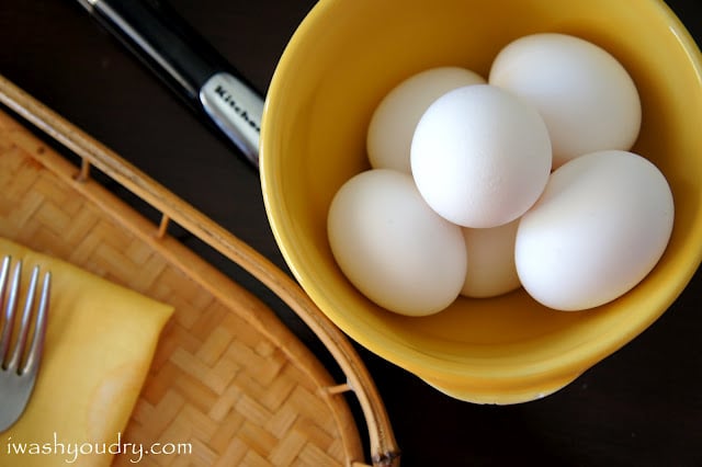 A display of eggs in a bowl on a table