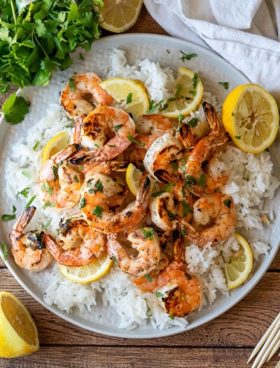 This Grilled Lemon Cilantro Shrimp Recipe is perfectly seasoned shrimp that are grilled up in minutes for a light and fresh Summer dinner.