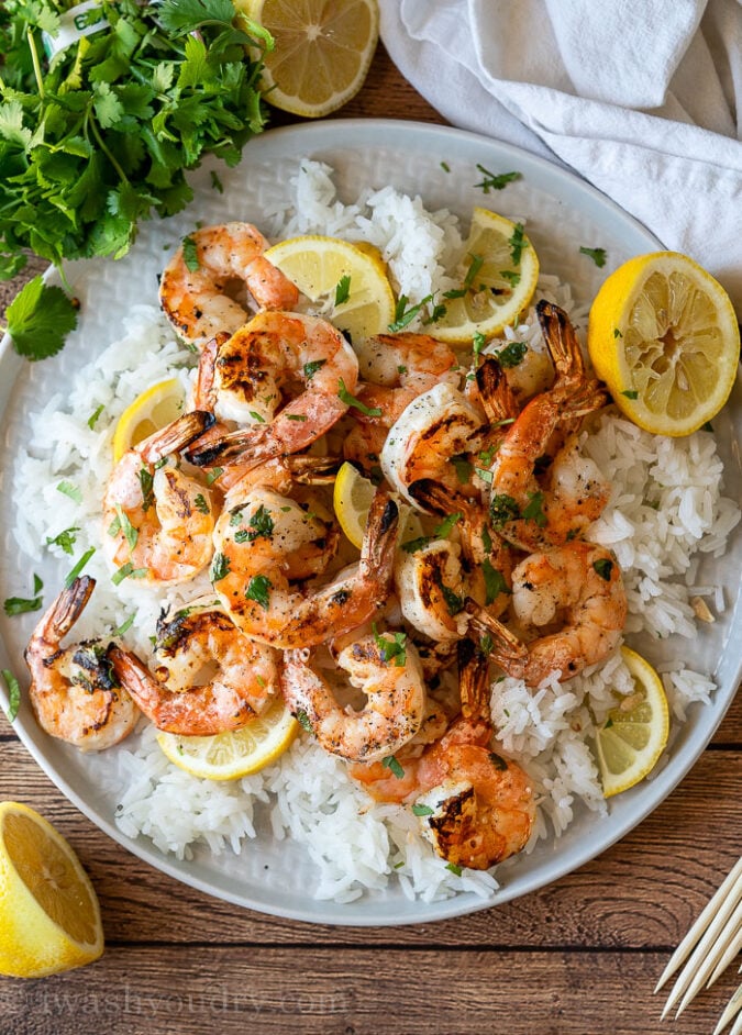This Grilled Lemon Cilantro Shrimp Recipe is perfectly seasoned shrimp that are grilled up in minutes for a light and fresh Summer dinner.