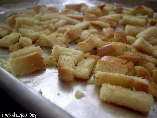 Close up of baked bread pieces on a pan. 