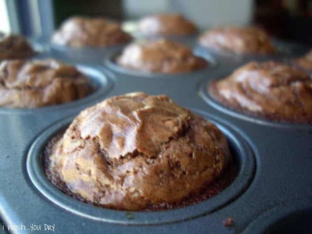 A close up of a baked brownie in a muffin tin. 
