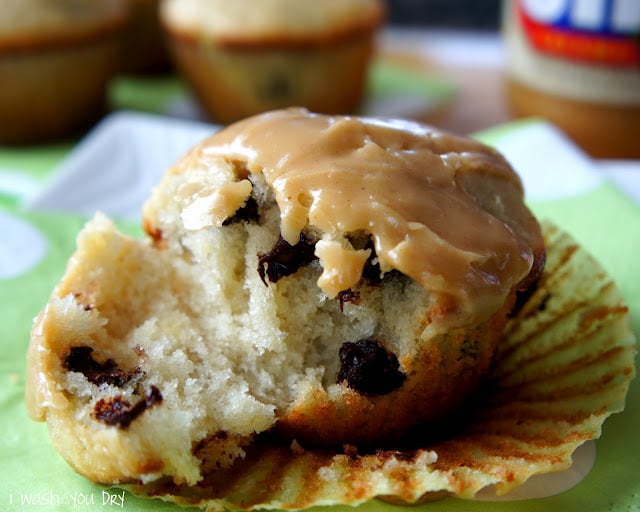 A close up of a chocolate chip muffin opened to show the inside.