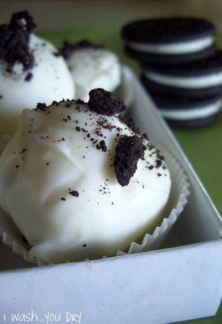 A close up of a white truffle in a mini cupcake liner. 