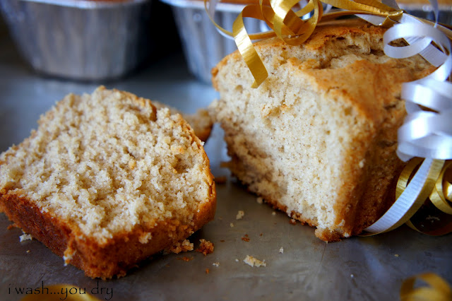 A slice piece of Eggnog Bread next to the rest of the law tied with a ribbon