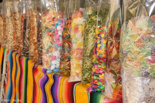 A row of large bags of candy.