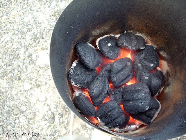 Coals warming in a metal container. 