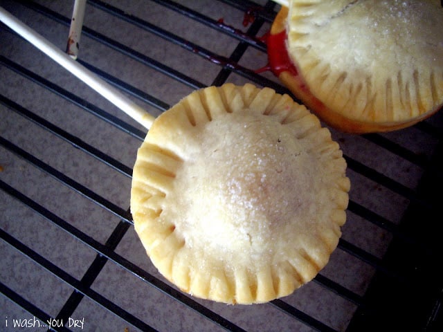 A baked mini pie pop cooling on a rack.