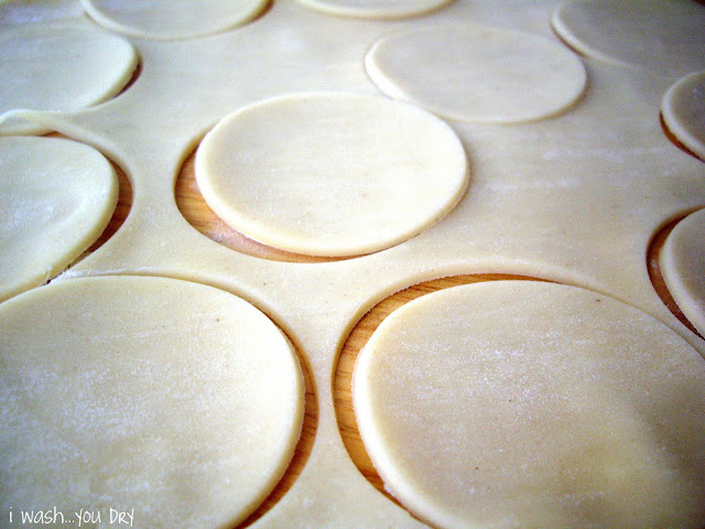 Circles cut into rolled out pie dough.