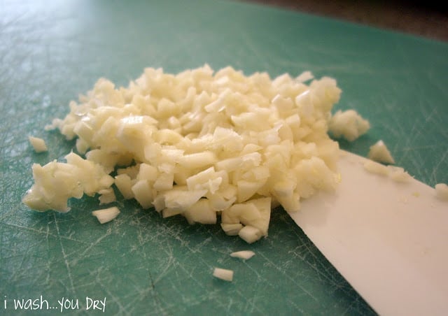 Chopped garlic on a cutting board. 