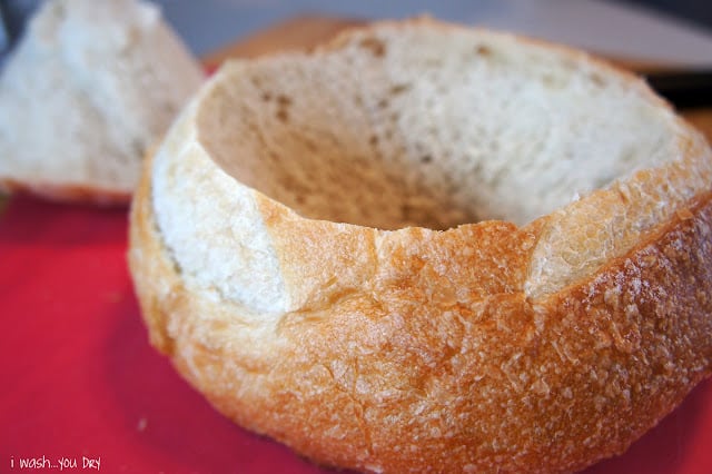 A close up of a round loaf of bread with the center removed.