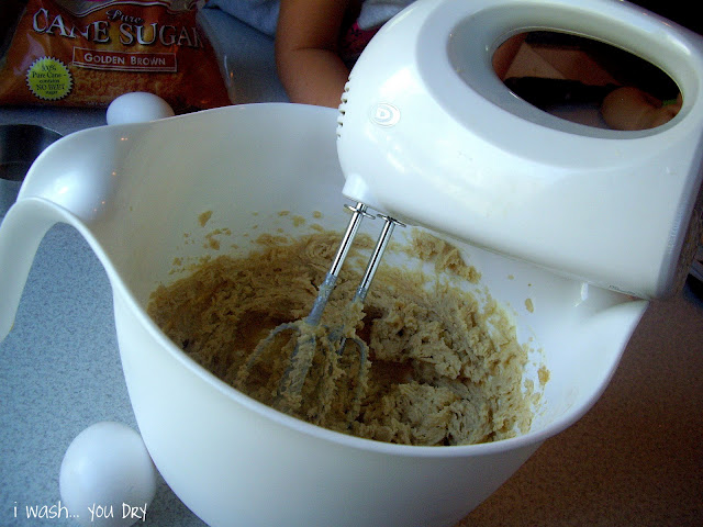 A mixer mixing dough. 