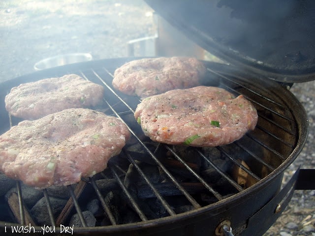 Garden Turkey Burger patties smoking on a grill. 