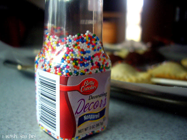 A close up of a bottle of sprinkles.