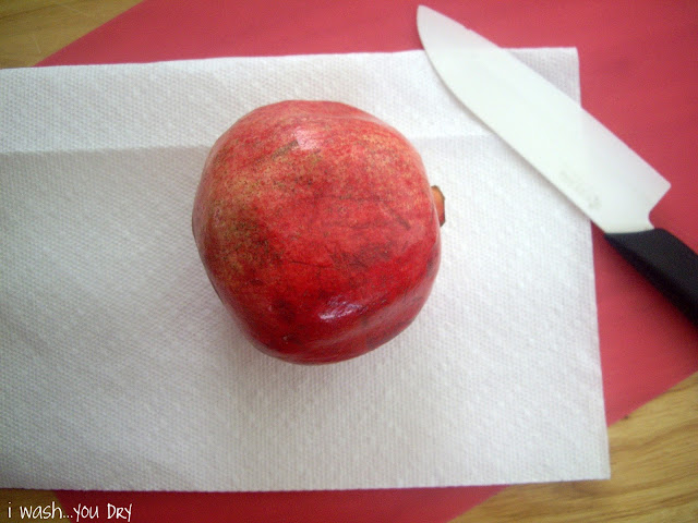 A pomegranate on a paper towel. 