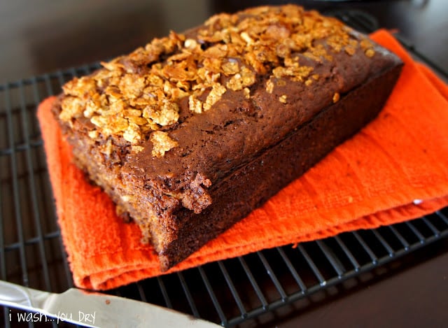 A loaf of Banana Nutella Crunch Breadon a cooling rack