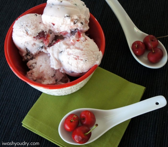 A close up of a bowl with scoops of Dark Chocolate Covered Cherry Frozen Yogurt