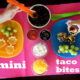 Mini Taco Bites and fixings showcased on a table with little hands making them