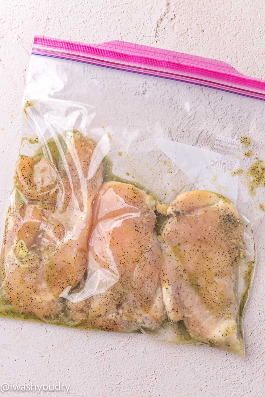 marinated chicken in zip close bag with olive oil.