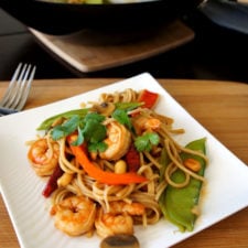 Kung Pao Shrimp Lo Mein displayed on a square plate