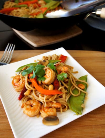 Kung Pao Shrimp Lo Mein displayed on a square plate
