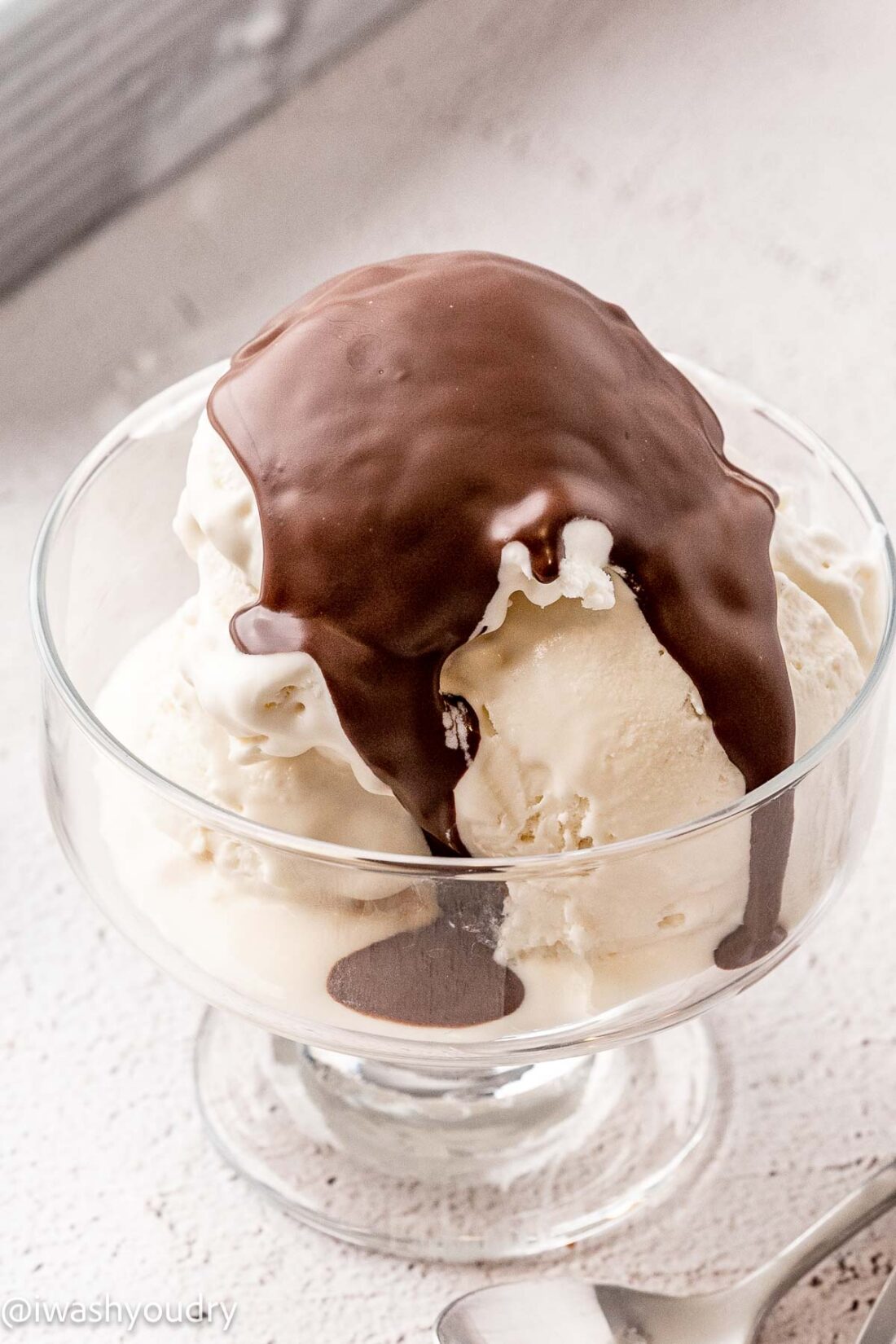 Hardened chocolate shell over vanilla ice cream. 