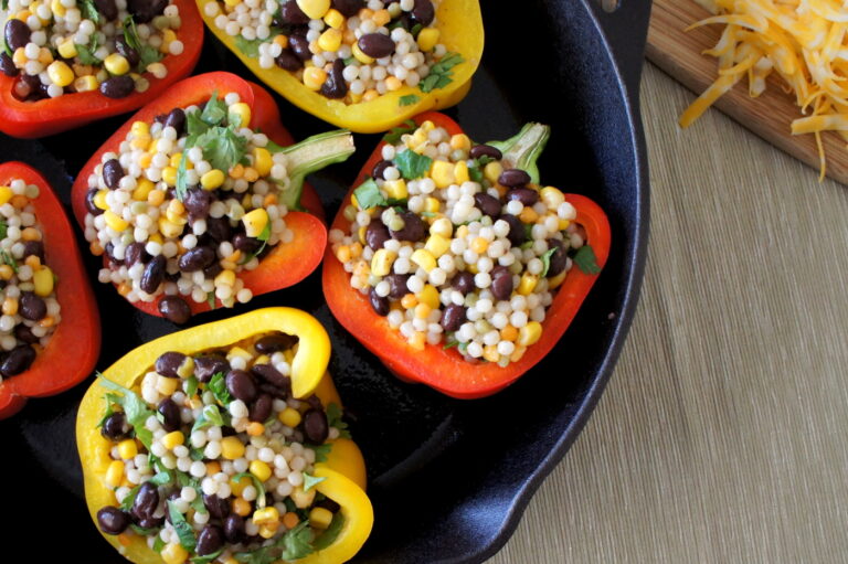 A close up of a pan filled with Couscous Stuffed Peppers