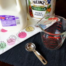 A display of ingredients needed to make buttermilk substitute using milk and vinegar