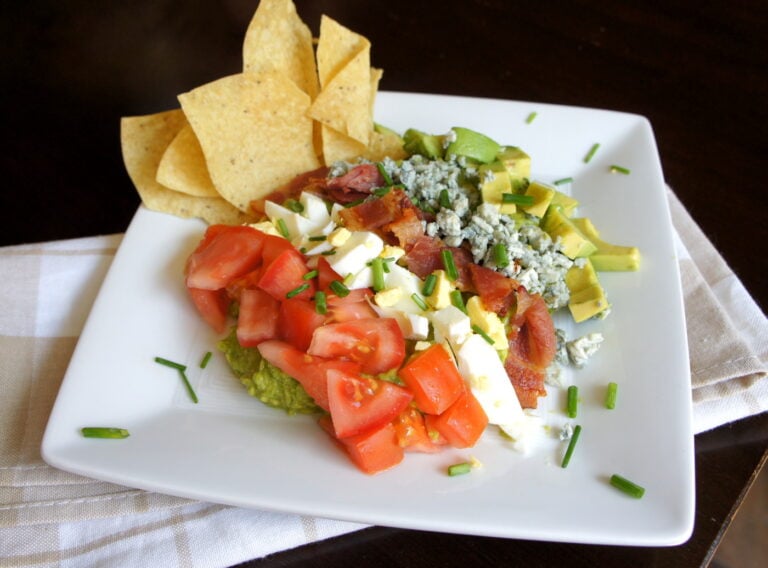 A plate showcasing Cobbocado Guacamole with a side of chips