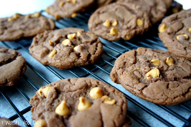 Chocolate cookies with peanut butter chips on a cooling rack