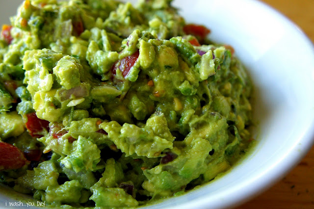 A close up of a bowl of guacamole.