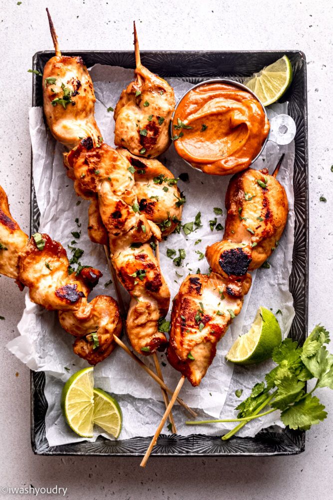 chicken satay with thai peanut sauce and limes