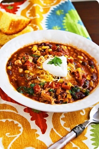 A large bowl of taco soup with chicken on a table