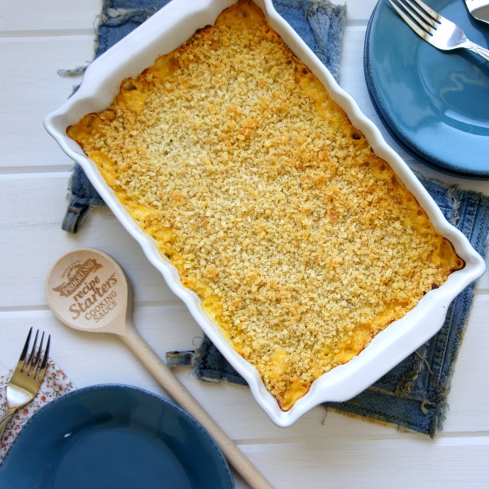 A pan of Cheesy Zucchini and Potato Casserole displayed on a table