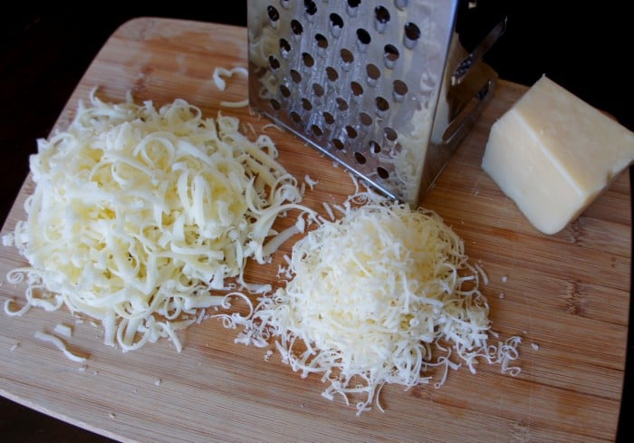 Shredded cheese on a cutting board