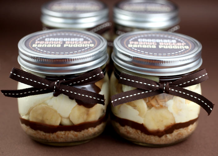 Chocolate Peanut Butter Banana Puddings in small mason jars tied with a bow